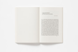 Open book with a blank left page and an essay on the right page