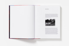A spread from John Loker: Horizons, Zones and Outer Spaces showing a blank left page with multicoloured edge, and a right page with an essay titled