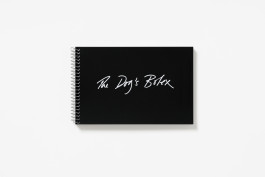 A black spiral-bound book cover titled 