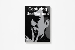 Black and silver book cover with a high-contrast image of a detail from an Andy Warhol self-portrait and the title 